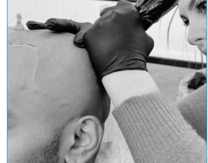 Bonnie treating a client during an in-home appointment